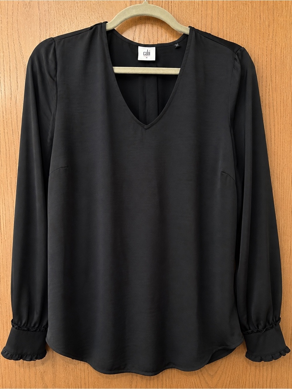 CAbi Classic Black V-Neck Blouse with Ruffled Cuffs